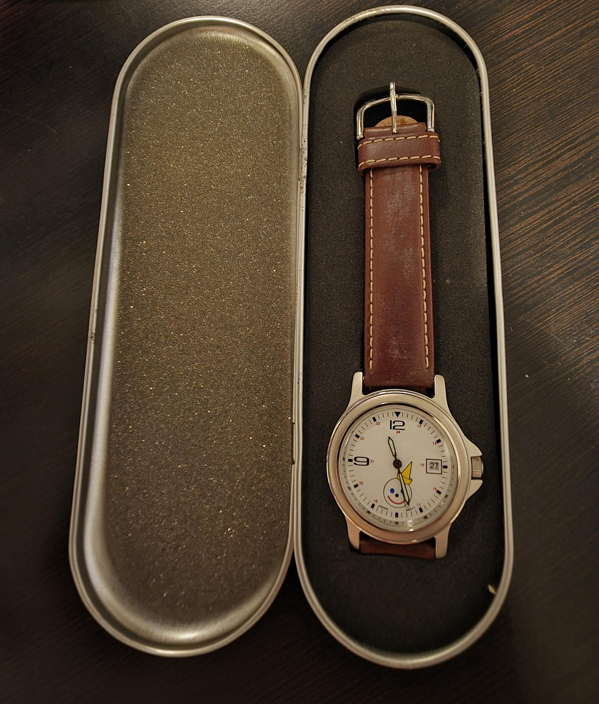 Jack in the Box collectible watch displayed inside original branded tin packaging