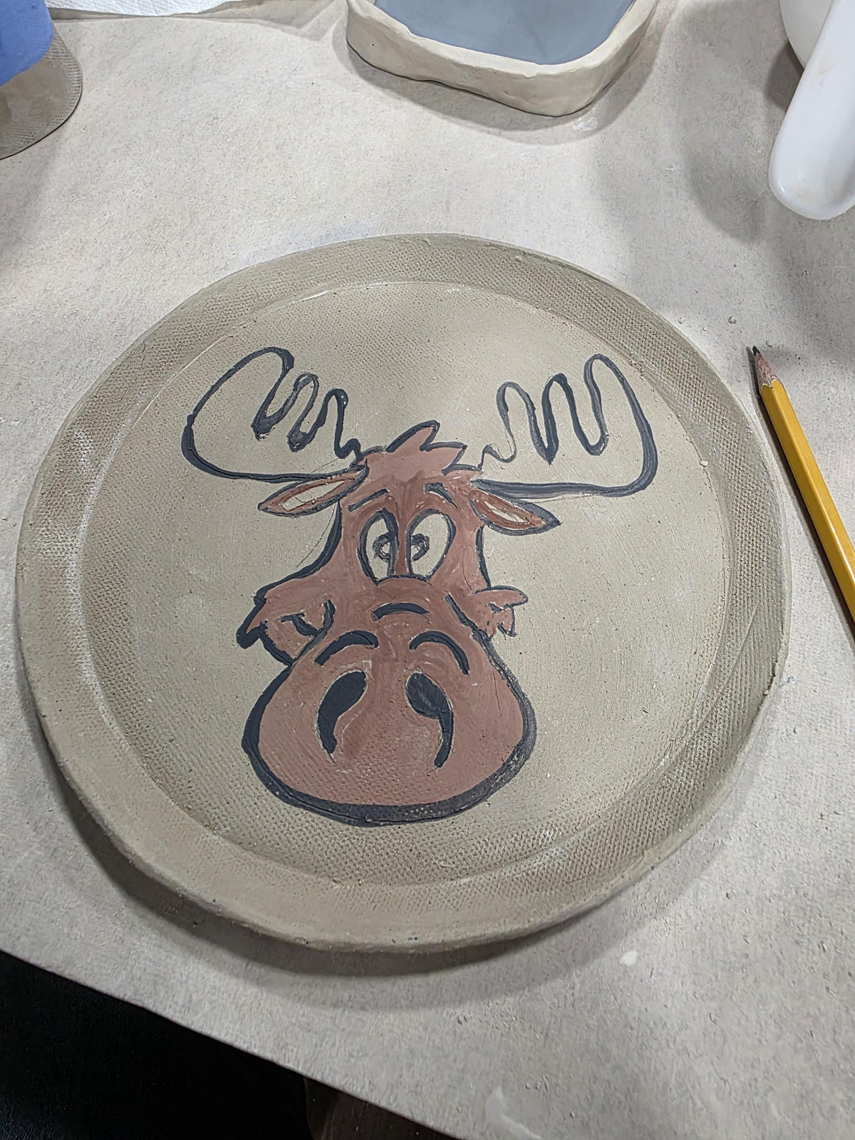 Custom hand-painted moose plate by Outer Reef Ceramics