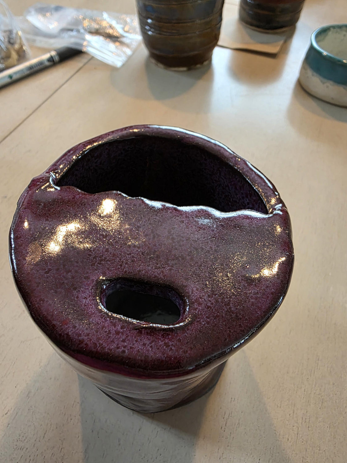 Handmade stoneware travel mug with lid by Outer Reef Ceramics