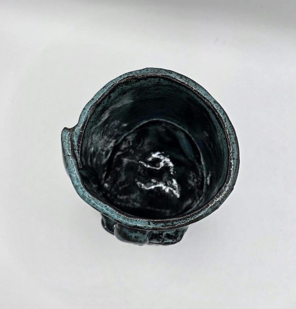 Octopus mug in black clay, handmade by Outer Reef Ceramics