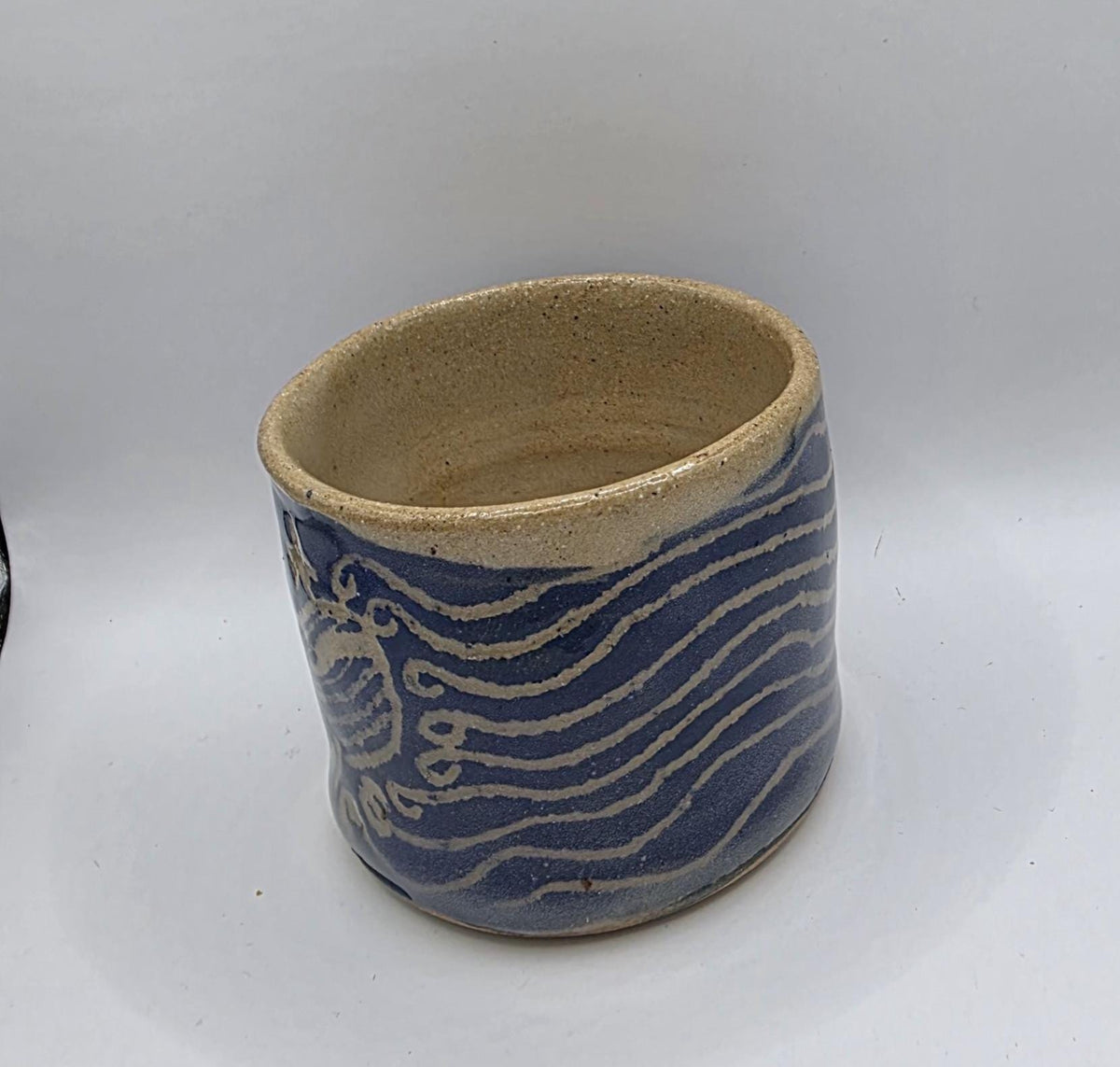 Carved whale tumbler, handmade by Outer Reef Ceramics