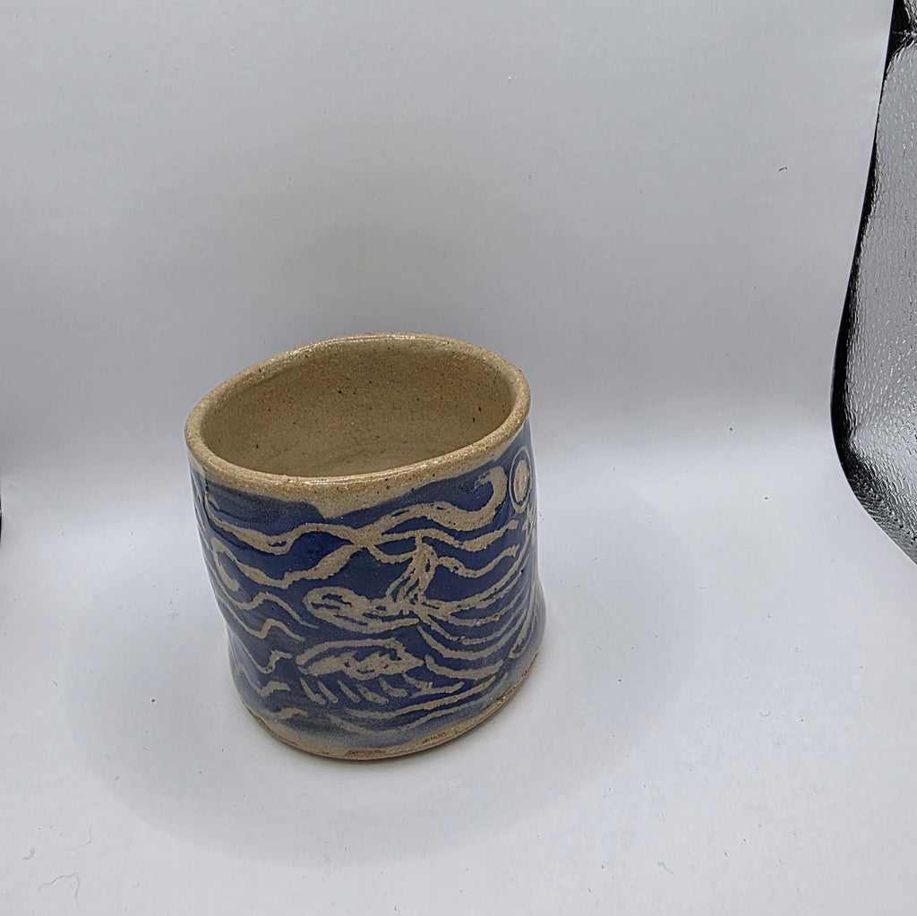Carved whale tumbler, handmade by Outer Reef Ceramics