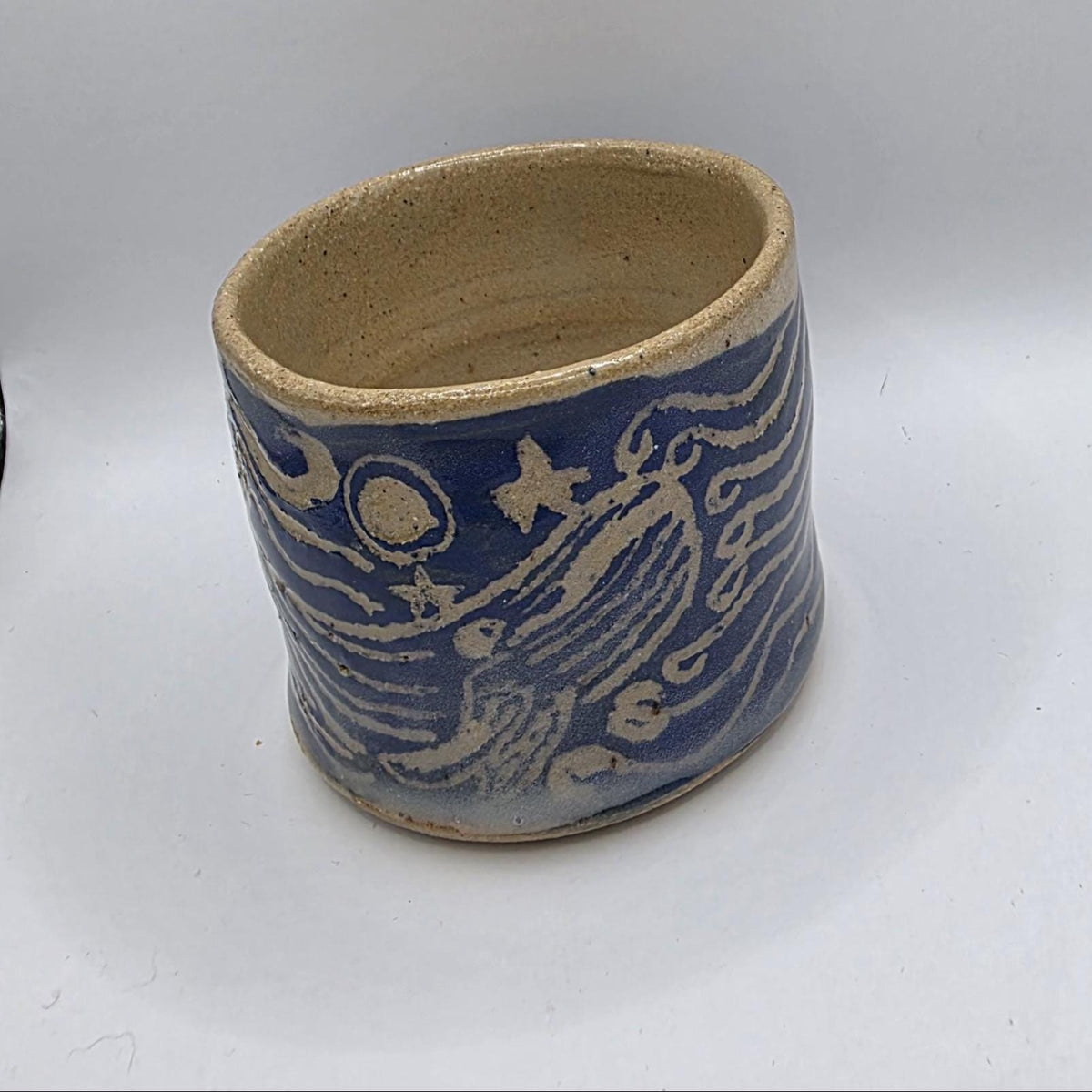 Carved whale tumbler, handmade by Outer Reef Ceramics