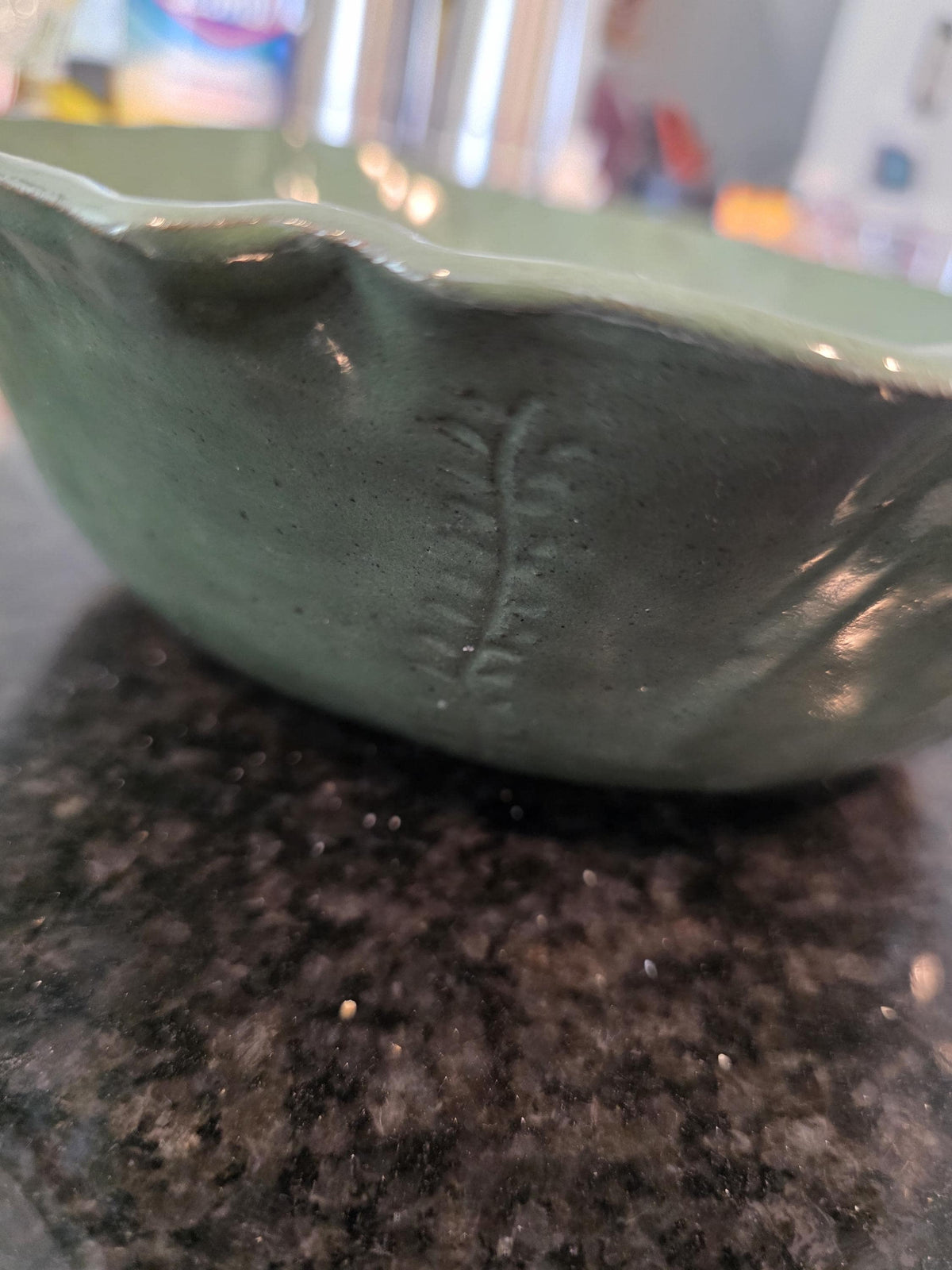 Carved leaf serving bowl in sage green, handmade by Outer Reef Ceramics