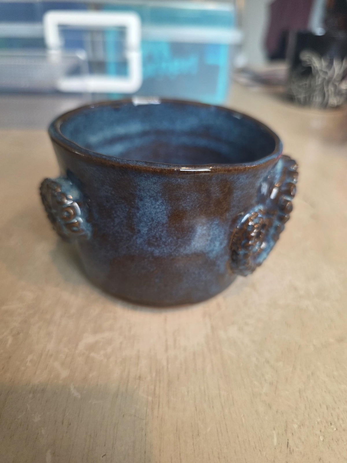 Octopus mug in black clay, handmade by Outer Reef Ceramics