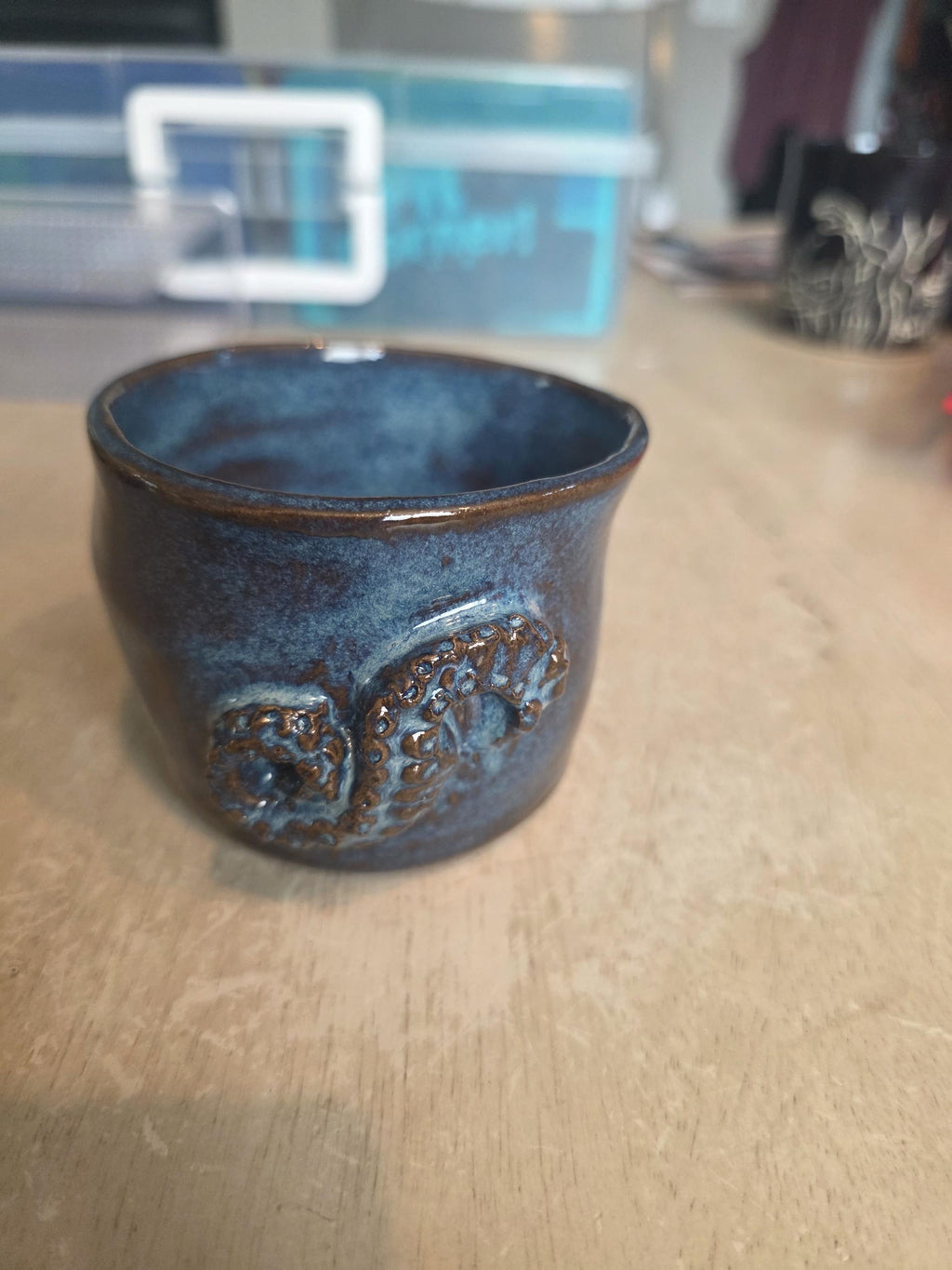 Octopus mug in black clay, handmade by Outer Reef Ceramics